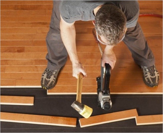 Man installing flooring product | Jack's Carpet & Tile