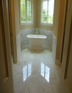 Bathroom tile flooring with bath tub | Jack's Carpet & Tile